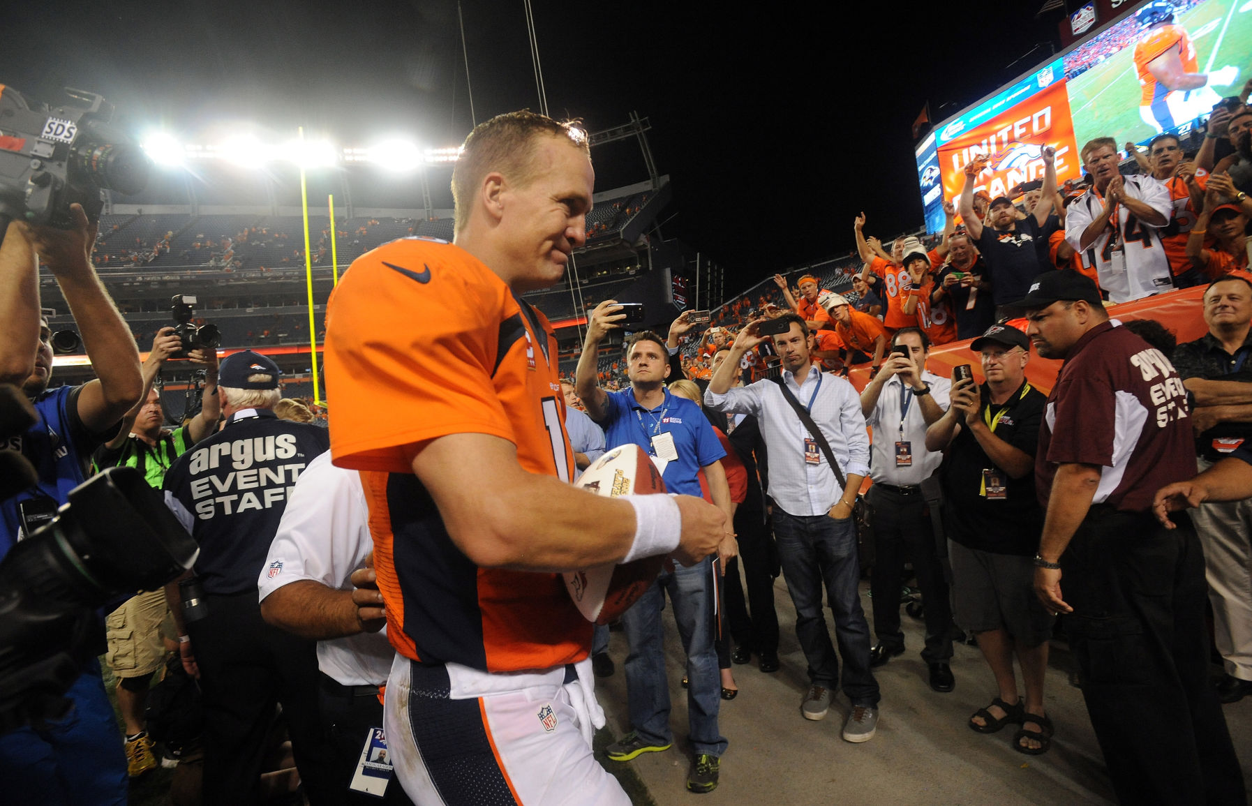 Broncos quarterback Peyton Manning leaves the field after throwing seven touchdown passes Thursday, Sept. 5, 2013, in the Broncos' 49-27 win over the Super Bowl champions Baltimore Ravens at Sports Authority Field at Mile High in Denver. (The Gazette, Christian Murdock)